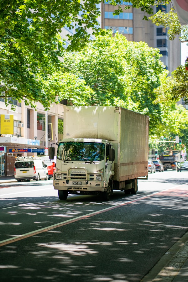 a truck driving down a street